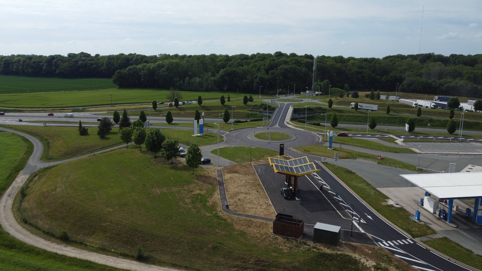 Image shows drone shot of a Fastned charging location for electric cars